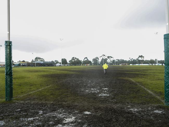 Players had to contend with a muddy corridor in the Seaford-Somerville match at Belvedere Reserve on Saturday. Picture: Valeriu Campan