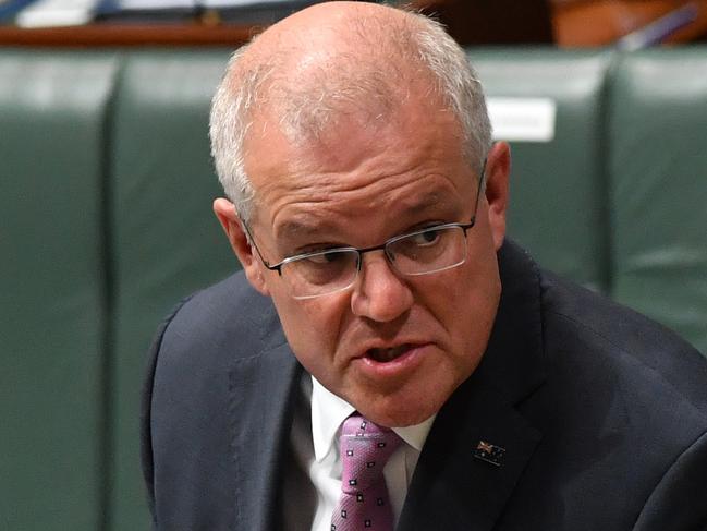 CANBERRA, AUSTRALIA - MARCH 15: Prime Minister Scott Morrison reacts during Question Time in the House of Representatives at Parliament House on March 15, 2021 in Canberra, Australia. Thousands are expected at Ã¢â¬ÅMarch 4 JusticeÃ¢â¬Â rallies across Australia, calling for action against gendered violence in Parliament, as news of the alleged rape of former Brittany Higgins at Parliament House and allegations that Attorney-General Christian Porter raped a 16-year-old gear when he was 17 in 1988 continue to cause outrage. (Photo by Sam Mooy/Getty Images)