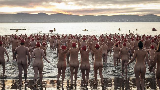 Participants begin the Nude Solstice Swim at Long Beach.