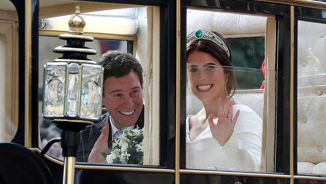 Britain's Princess Eugenie of York and her husband Jack Brooksbank travel in the Scottish State Coach at the start of their carriage procession. Picture: AP