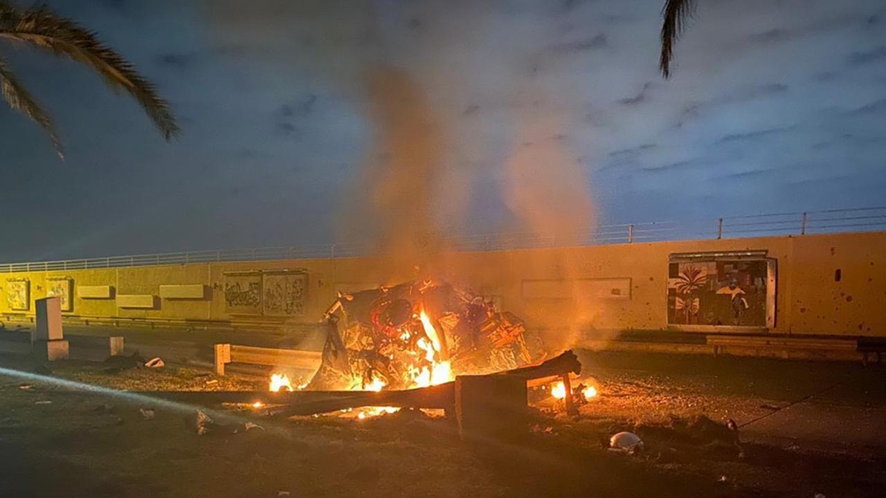 This photo released by the Iraqi Prime Minister Press Office shows a burning vehicle at the Baghdad International Airport following an airstrike in Baghdad. Picture: Supplied