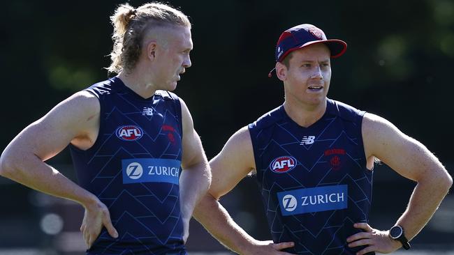 Lachie Hunter (right) gets into the groove alongside Clayton Oliver at Melbourne training. Picture: Michael Klein