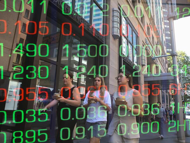 ????SYDNEY, AUSTRALIA : NewsWire Photos - FEBRUARY 24 2025; A general view of people walking past the digital boards of the ASX in the Sydney CBD. Picture: NewsWire/ Gaye Gerard