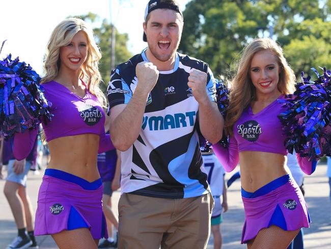 Andrew Wilson from Cronulla with a couple of Melbourne Storm cheerleaders at the 2016 NRL Grand Final between the Cronulla Sharks and the Melbourne Storm. Picture: Adam Taylor