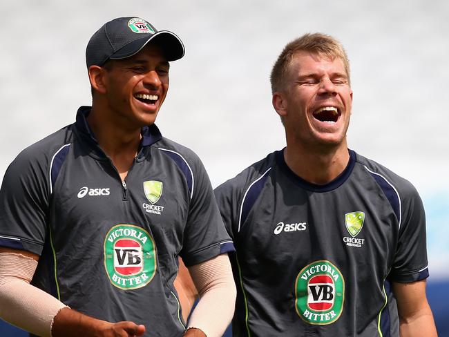 Usman Khawaja and Dave Warner share a joke at training.