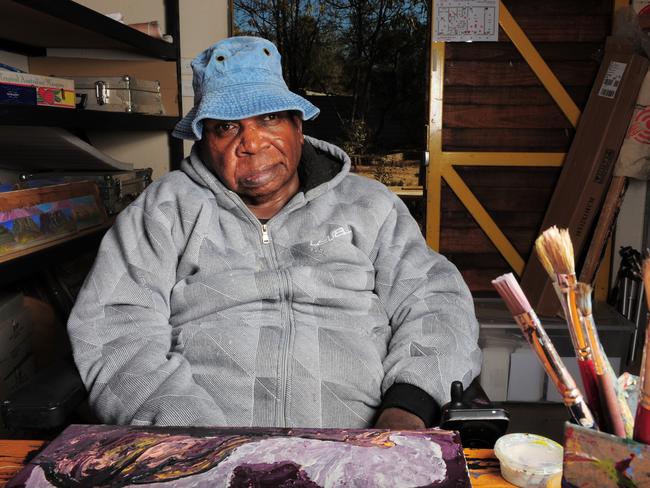 Adrian Robertson sitting at a work station. Adolphs said of the portrait: “I took a lot of photos, as my usual work is photography-based. Back in my studio, I made several more portraits. This painting is quite simple, but I think it captures Adrian’s quiet confidence and self-assurance as a painter.”