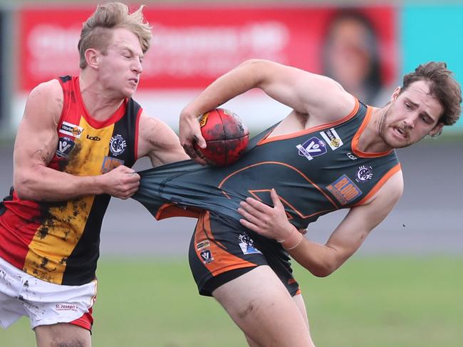 St Joseph’s Lewis Antonac tackles Giant Josh Dwyer. Picture: Alan Barber