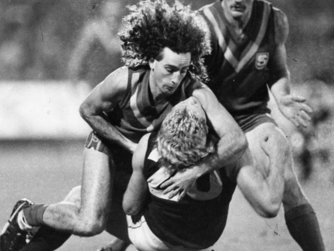 John Platten tackles Dermott Brereton in 1987.