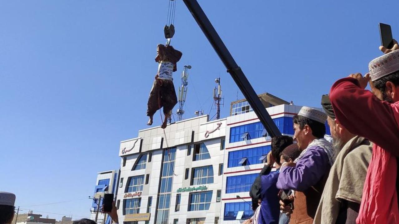 A body hanging on a crane in Herat on September 25, 2021, after a Taliban official said it killed four kidnappers during a shootout. Picture: AFP