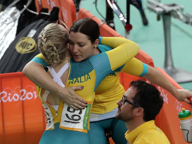 Stephanie Morton returns to the pits and gets a hug from Anna Meares after being beaten during the Women's Sprint at the Rio Olympics 2016 track cycling at the Rio Olympic Velodrome. Pics Adam Head