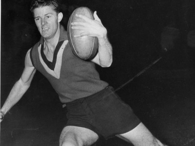 West Adelaide footballer Jack Lynch wearing State guernsey at training 1952.