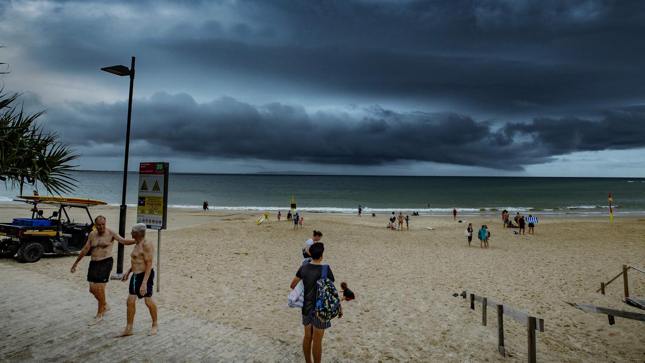 Beachgoers leaving Noosa Main Beach after it was closed due to severe thunderstorm warnings earlier this year. Photo Lachie Millard