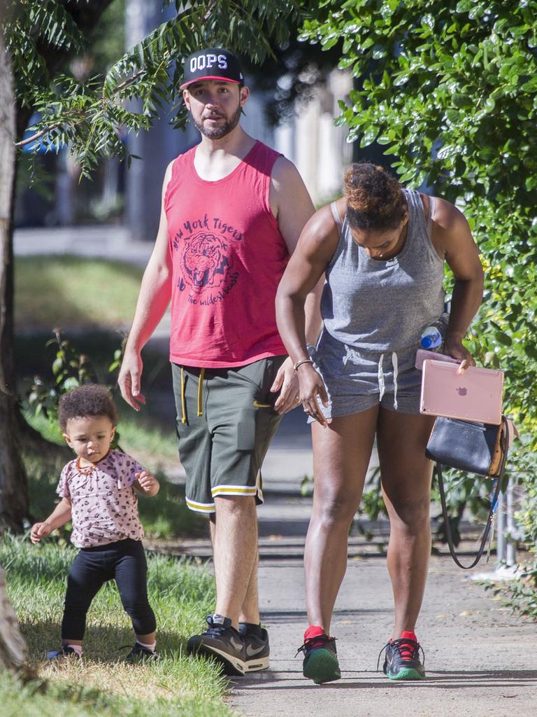 Serena Williams and her husband Alexis Ohanian enjoy an afternoon walk with their 1-year-old daughter Alexia Olympia. Serena's daughter looked seriously cute, toddling her way down the footpath, wearing Nike sneakers like her Mummy. Picture: MediaMode 