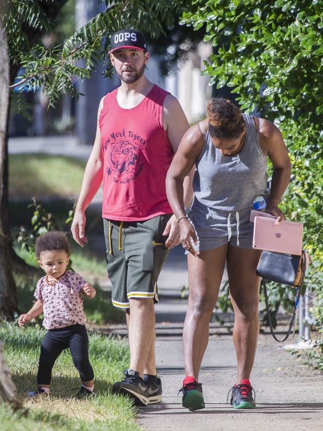 Serena Williams and her husband Alexis Ohanian enjoy an afternoon walk with their 1-year-old daughter Alexia Olympia. Serena's daughter looked seriously cute, toddling her way down the footpath, wearing Nike sneakers like her Mummy. Picture: MediaMode