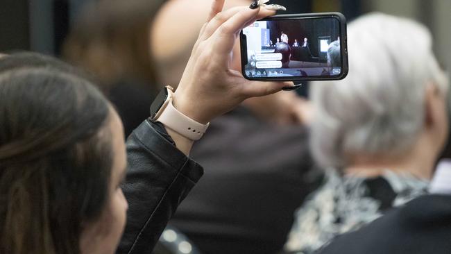 A member of the audience capturing the debate on video. Picture: Matthew Vasilescu
