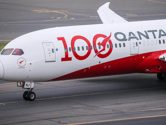 SYDNEY, AUSTRALIA - NOVEMBER 16: A Boeing 787 Dreamliner aircraft, Qantas flight QF100 prepares to take off from Kingsford Smith International airport as part of Qantas 100th Birthday celebrations on November 16, 2020 in Sydney, Australia. Australia's national airline Qantas is celebrating 100 years. (Photo by David Gray#JM/Getty Images for Destination New South Wales/Qantas)