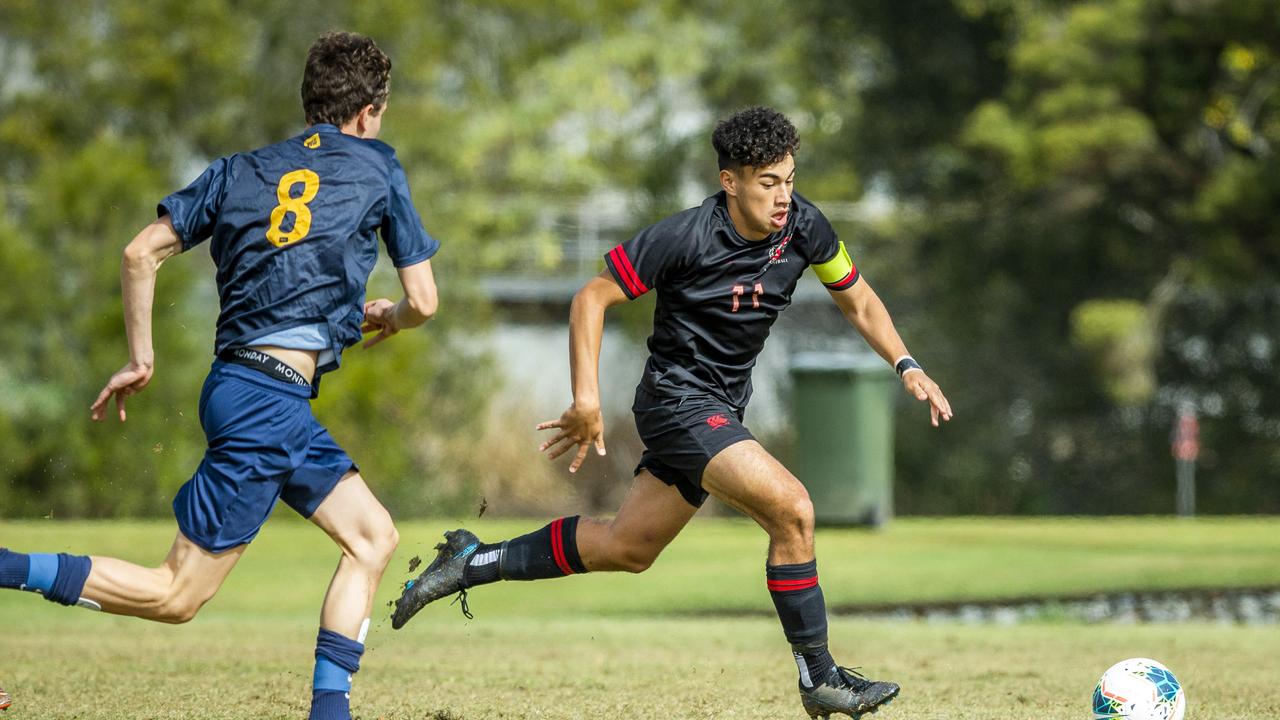 Toowoomba's Jack DeBortoli goes in for the tackle on Malakai Love-Semira from St Joseph's Gregory Terrace in the First XI Football (soccer) match between St Joseph's Gregory Terrace and Toowoomba Grammar School at Tennyson, Saturday, July 25, 2020 - Picture: Renae Droop