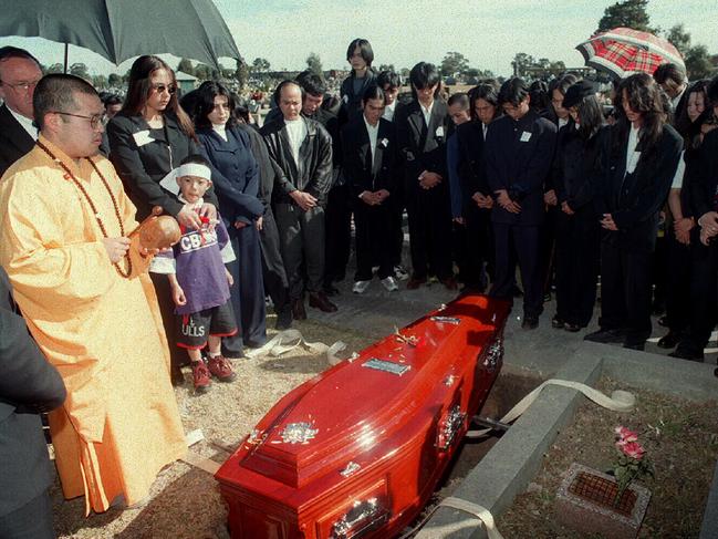 Mourners gather for the funeral service of murdered 5T gang leader Tri Minh Tran at Liverpool cemetery in 1995, shot dead in a Cabramatta block of units.