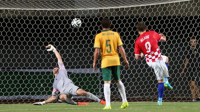 Nikica Jelavic of Croatia scores a goal past Socceroos goal-keeper Mat Ryan.)