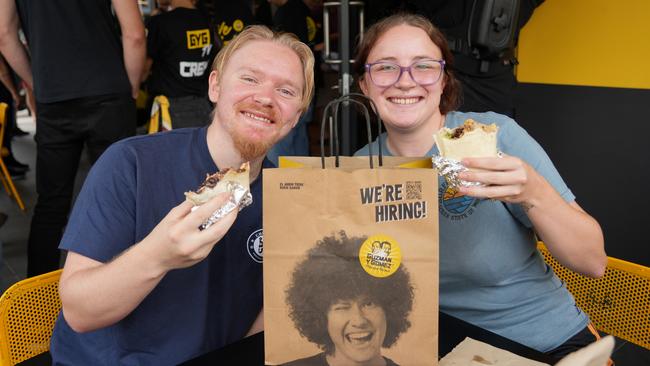 The launch of Toowoomba's first Guzman Y Gomez drive-through restaurant at Wilsonton, February 15, 2024. Customers Isaac Kleidon and Jessica Tate enjoy their lunches.