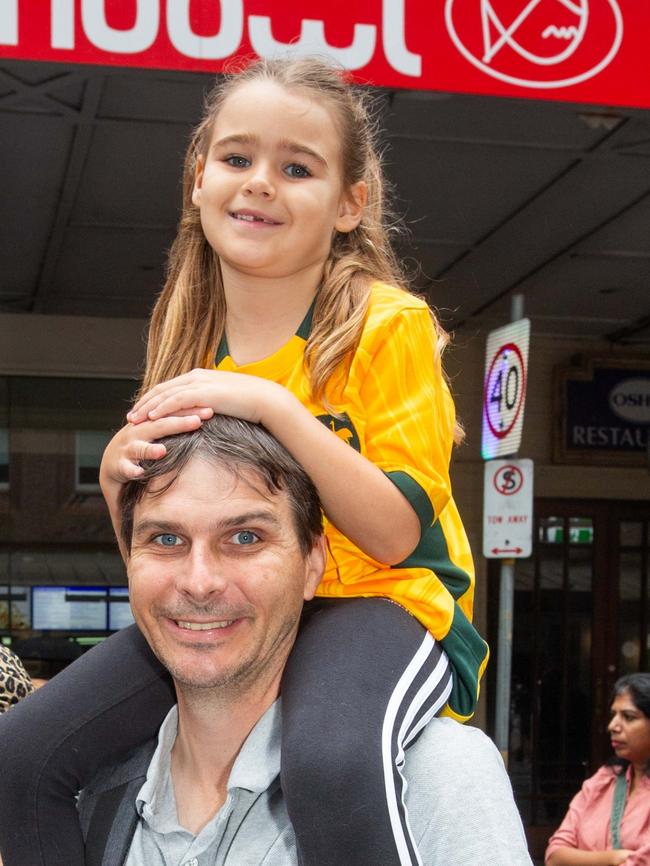 Thousands of people have braved the rain to gather in Brisbane for Anzac Day services. Picture: Grace Kessels