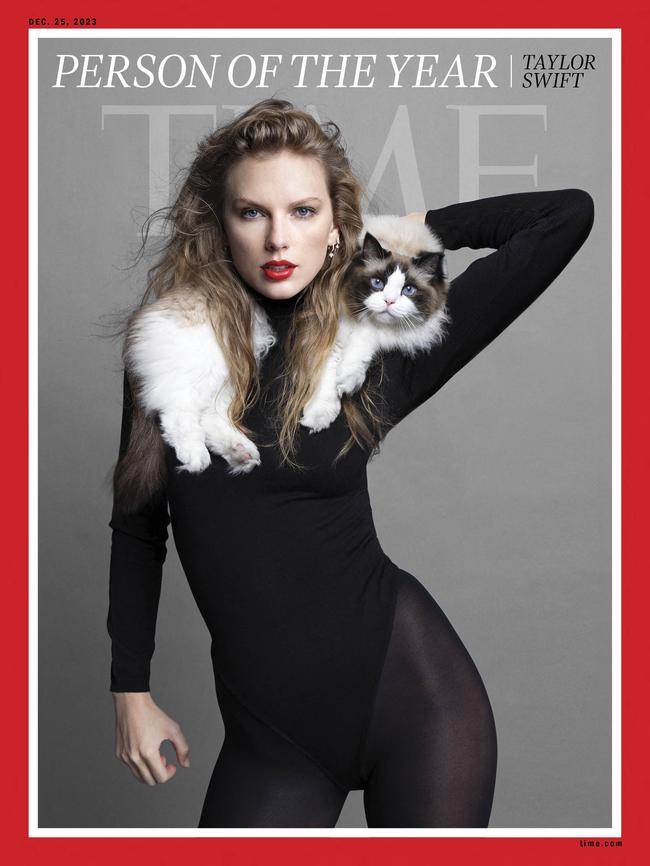 Taylor Swift on the front cover of Time Magazine with her cat. Picture: TIME / AFP