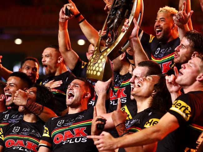 BRISBANE, AUSTRALIA - OCTOBER 03:  The Panthers celebrate with the NRL Premiership Trophy after victory in the 2021 NRL Grand Final match between the Penrith Panthers and the South Sydney Rabbitohs at Suncorp Stadium on October 03, 2021, in Brisbane, Australia. (Photo by Chris Hyde/Getty Images)