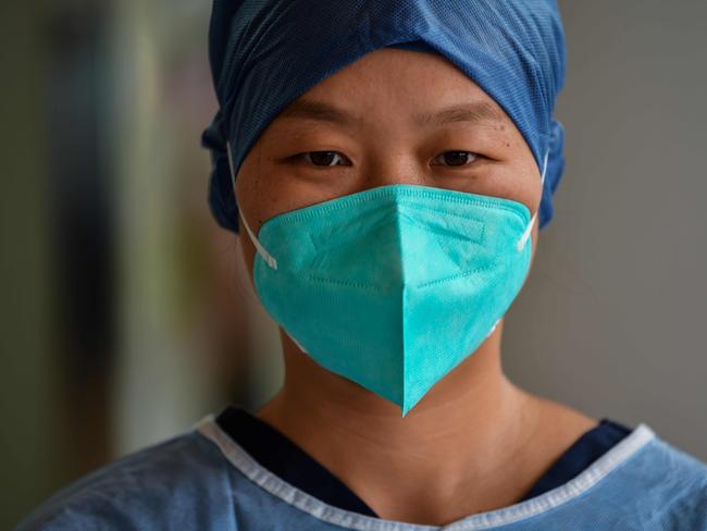 One of Wuhan’s medical workers. There has been a culture of silence forced on medical workers and families of victims. Picture: AFP