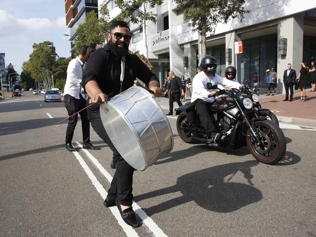 Drummers and Harley-Davidsons welcomed the bride and groom at the wedding. Picture: David Swift