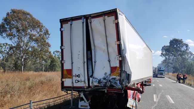 A refrigerated B-double was hit from behind after two trucks collided and burst into flames on the Bruce Highway, 37km south of Miriam Vale, on August 5. Picture: Rodney Stevens