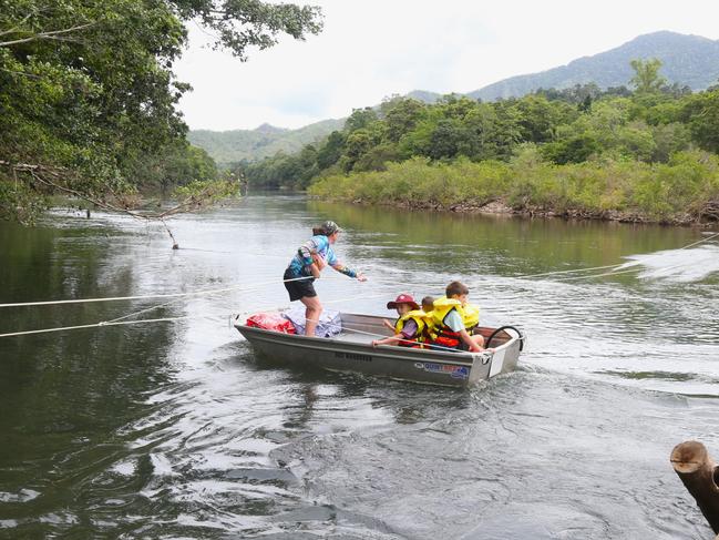 WATCH: Students forced to cross croc river to get to school after floods