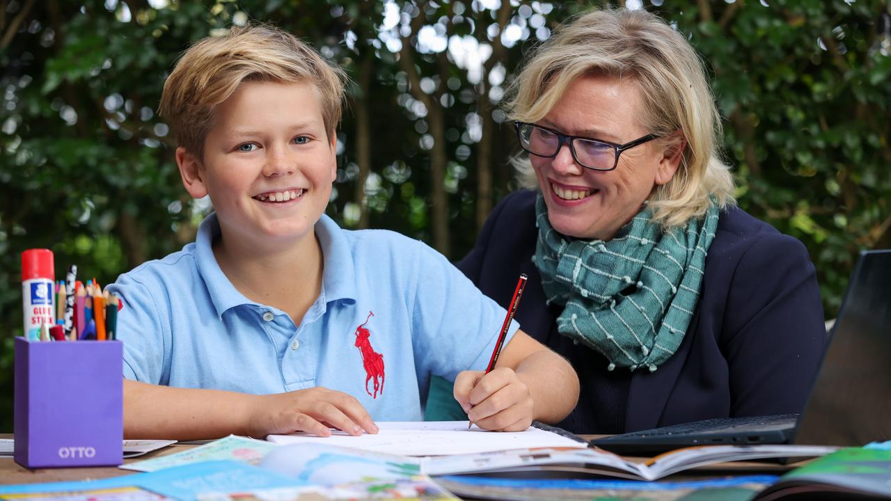 Archie Isaac, 11, with his mum Jenny Atkinson, who recommends handwriting a story and doing a drawing to get started. Picture: Justin Lloyd