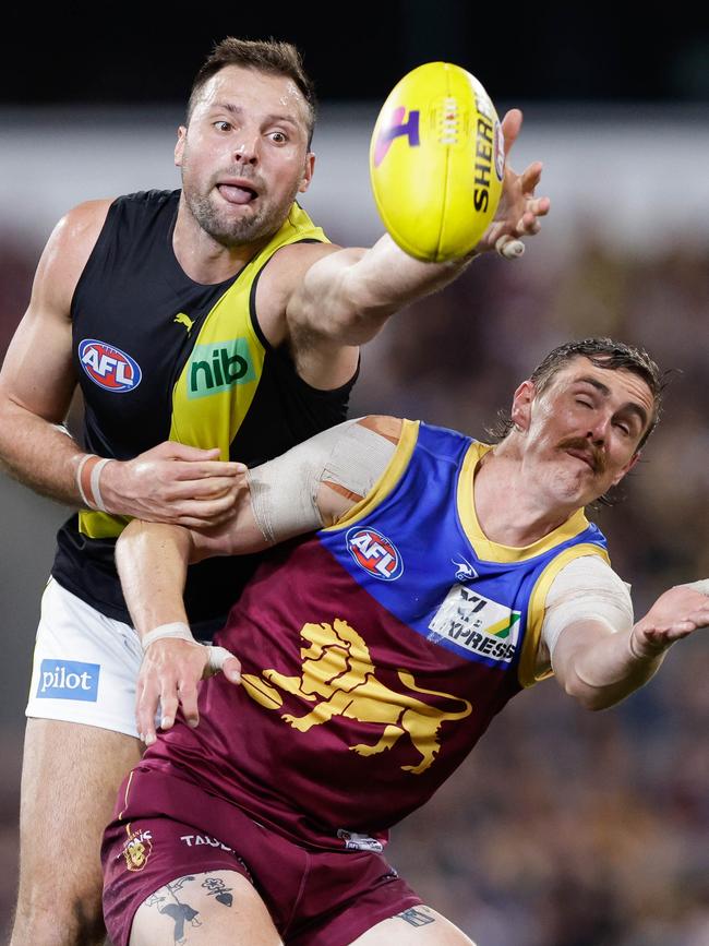 Joe Daniher in a ruck contest against Toby Nankervis.