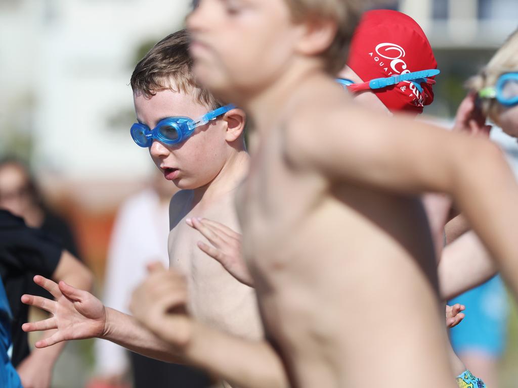 Participants competing in the Bupa KidFit Series triathlon at Blackmans Bay Beach. Picture: LUKE BOWDEN