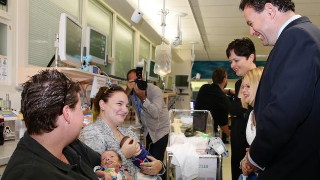 Penrith state Liberal MP Stuart Ayres in Nepean Hospital’s neonatal ward handing over a new cot. Picture: Matthew Sullivan