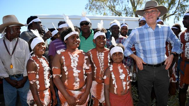 Prime Minister Malcolm Turnbull meets a dance troupe after arriving at Tennant Creek in the Northern Territory on Sunday. Picture: AAP