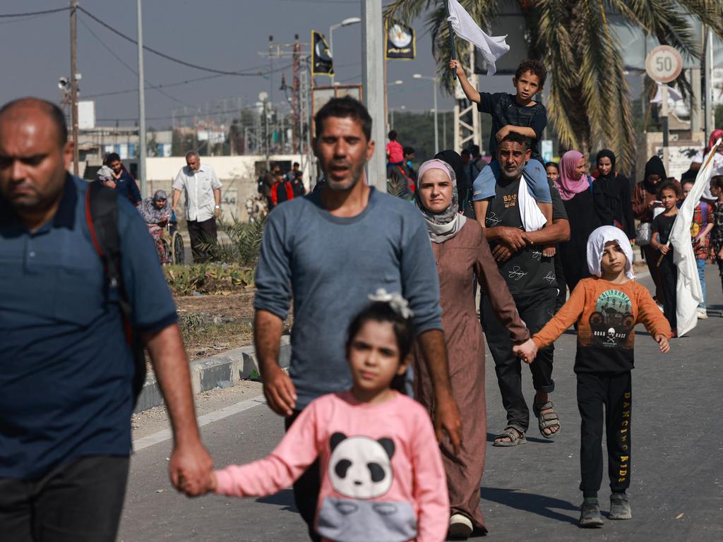 Some of the civilians fleeing Gaza waved white flags. Picture: AFP
