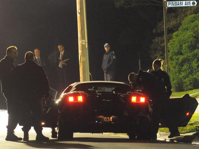 Police examine Fadi Ibrahim’s Lamborghini after he was shot by a would be assassin outside his Castle Cove home on June 5, 2009.