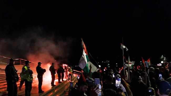 Pro-Palestine supporters are rallying at Sydney Town Hall as the conflict between Israel and Palestinians escalates. They marched form Town Hall to the Sydney Opera House. Flares and fireworks were lit at one stage. Picture: David Swift