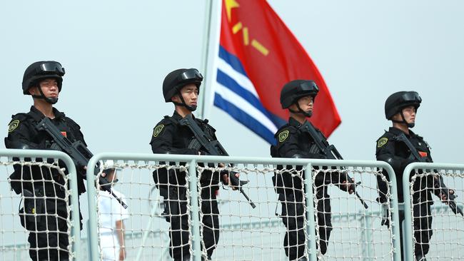 Members of the Chinese Navy stand at a military port in Zhoushan, China. What might be Australia’s role if there is a regional conflict later this decade? Picture: Getty