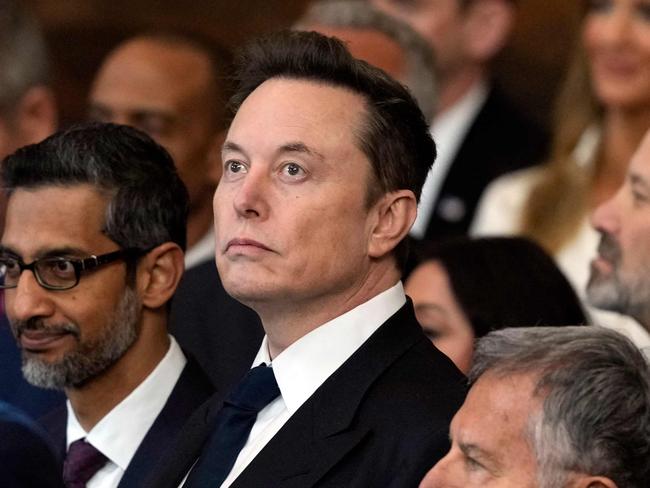 Google CEO Sundar Pichai (C, L) and SpaceX, X and Tesla CEO Elon Musk watch during the inauguration of Donald Trump as the 47th president of the United States in the Rotunda of the US Capitol in Washington, DC, on January 20, 2025. Trump takes office for his second non-consecutive term as the 47th president of the United States. (Photo by Julia Demaree Nikhinson / POOL / AFP)