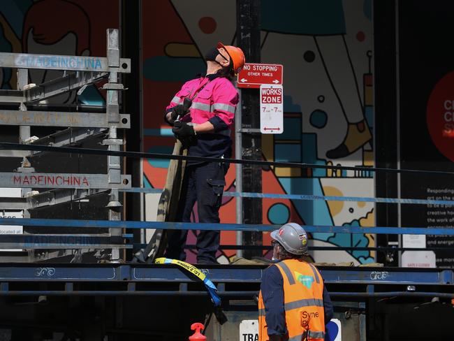 Construction workers labor at a site in the central business district (CBD) of Sydney, Australia, on Tuesday, Sept. 28, 2021. Australian household spending declined for a third consecutive month as the delta variant of coronavirus swept the east coast and nations largest cities. Photographer: Lisa Maree Williams/Bloomberg via Getty Images