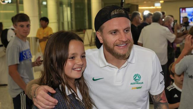 Jason Cummings took photos with fans, as hundreds came to Sydney Airport to say hello to their new heroes. Picture: Getty Images.