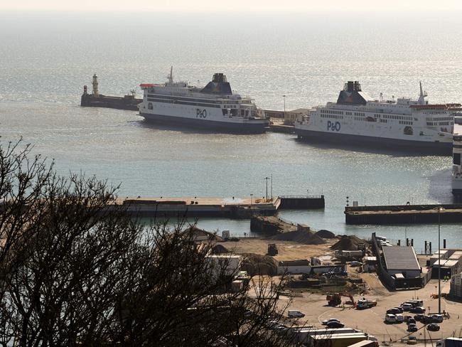 P&O ferries, 'Pride of Canterbury' (L), 'Pride of Kent' (C) and 'Spirit of Britain', are pictured moored to the quayside at the Port of Dover on the south-east coast of England, on March 18, 2022. - P&O Ferries, which sails daily between Britain and France, on Thursday axed 800 UK crew with immediate effect and suspended services in a bid to stay afloat, sparking protests from angry staff and trade union fury. The Dubai-owned group announced it has shed more than one quarter of its staff in a drastic restructuring to save cash, and halted services for the next few days. (Photo by Glyn KIRK / AFP)