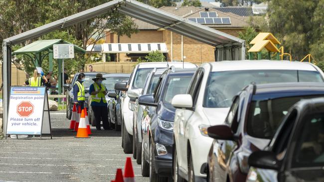 Cars queue at Prestons drive-through COVID-19 testing clinic at the Ash Road Sporting Complex in Sydney. Picture: NCA NewsWire / Jenny Evans