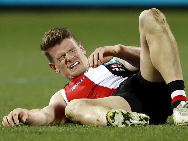 GEELONG, AUSTRALIA - AUGUST 14: Darragh Joyce of the Saints lays injured during the 2021 AFL Round 22 match between the Geelong Cats and the St Kilda Saints at GMHBA Stadium on August 14, 2021 in Geelong, Australia. (Photo by Dylan Burns/AFL Photos via Getty Images)