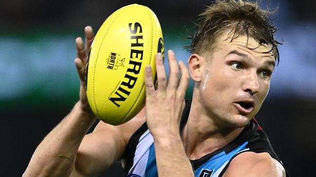 MELBOURNE, AUSTRALIA - MARCH 21: Ollie Wines of the Power marks during the round one AFL match between the North Melbourne Kangaroos and the Port Adelaide Power at Marvel Stadium on March 21, 2021 in Melbourne, Australia. (Photo by Quinn Rooney/Getty Images)