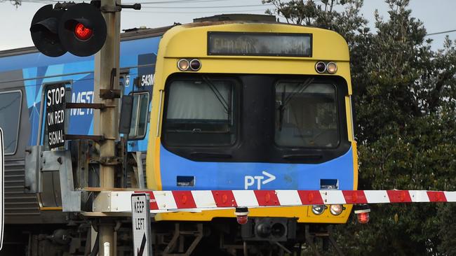 A train at a level crossing on the Frankston line. Picture: Chris Eastman