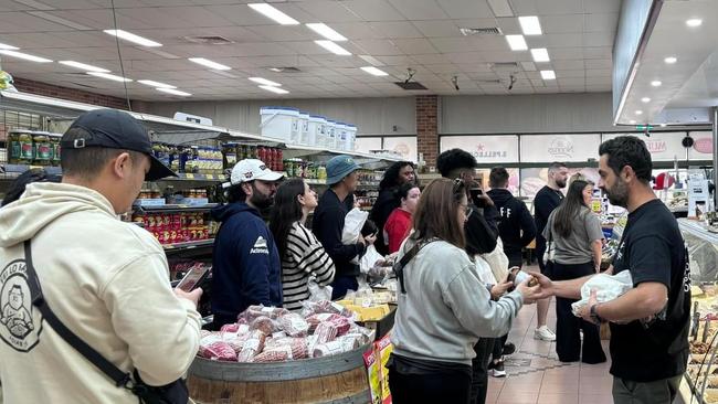 Customers wait patiently for sandwiches on the last day the business was open. Picture: Facebook