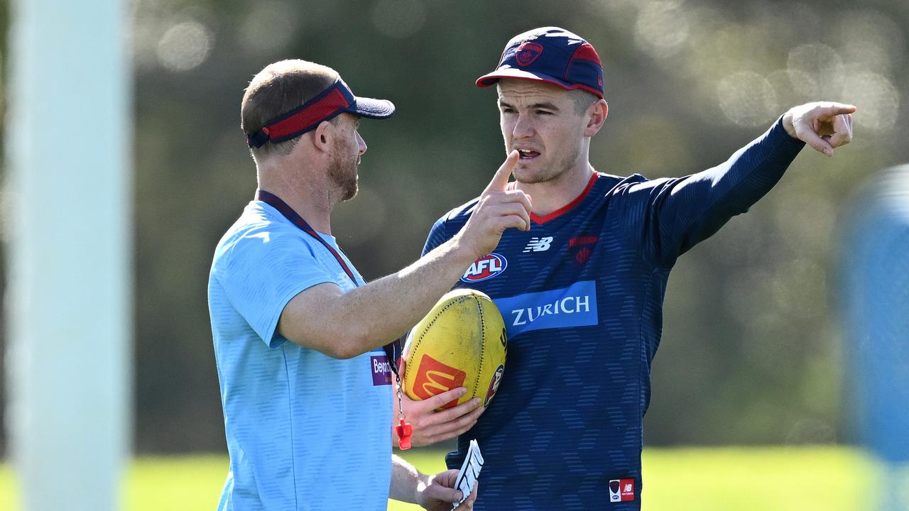 MELBOURNE, AUSTRALIA - SEPTEMBER 04: Demons head coach Simon Goodwin speaks to Bayley Fritsch of the Demons during a Melbourne Demons AFL training session at Casey Fields on September 04, 2023 in Melbourne, Australia. (Photo by Quinn Rooney/Getty Images)